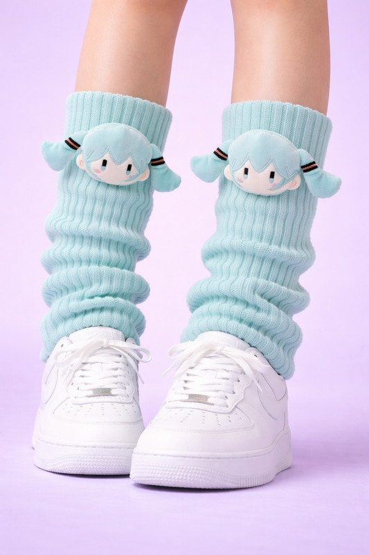 Light blue socks with cartoon character design worn with white sneakers on a light purple background