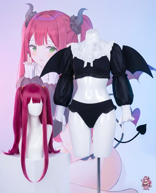 Black and white outfit with bat wings on a mannequin, pink hair wig in front