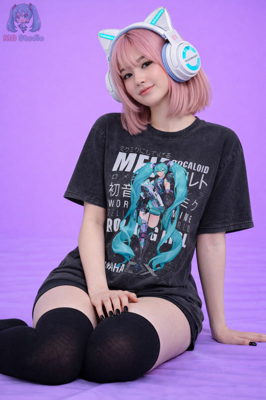 Person wearing a black t-shirt with graphic design and cat ears on a purple background