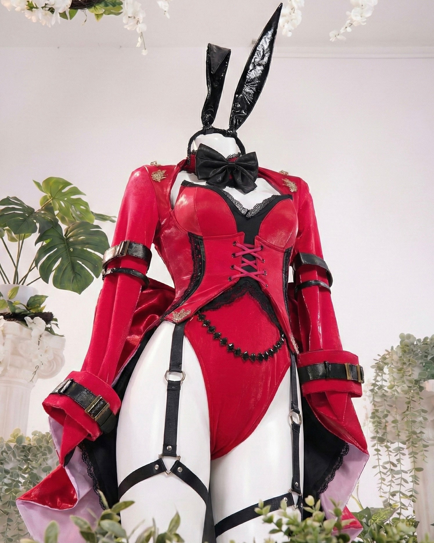 Red and black costume with bunny ears on a white background