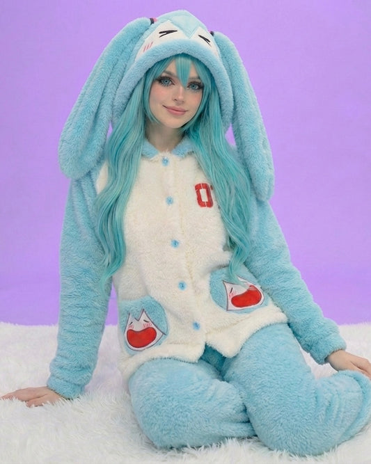 Person wearing a blue and white bunny costume with long ears against a purple background