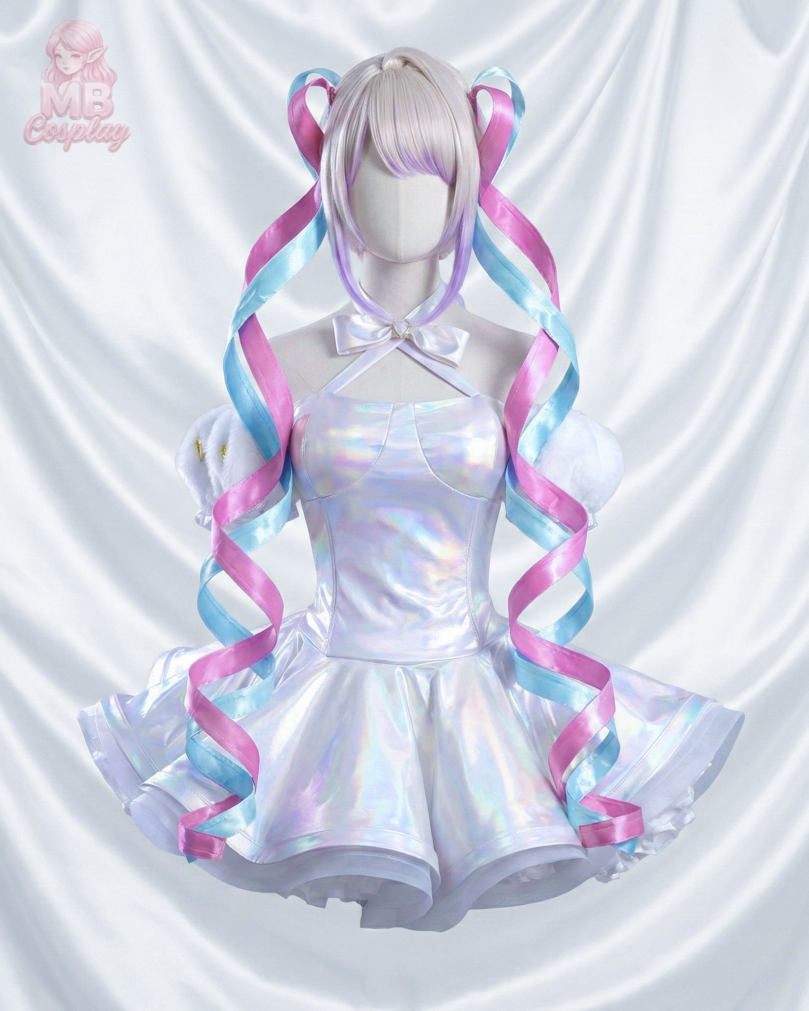 Close-up of KAngel iridescent laser pleated skirt and pink ribbon accents