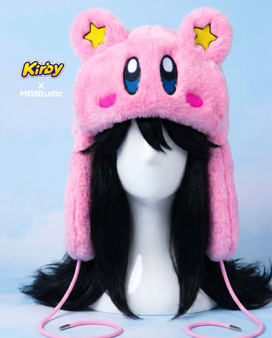 Kirby inspired pink plush winter hat featuring embroidered eyes, blush cheeks and yellow star ears, kawaii anime cosplay accessory front view