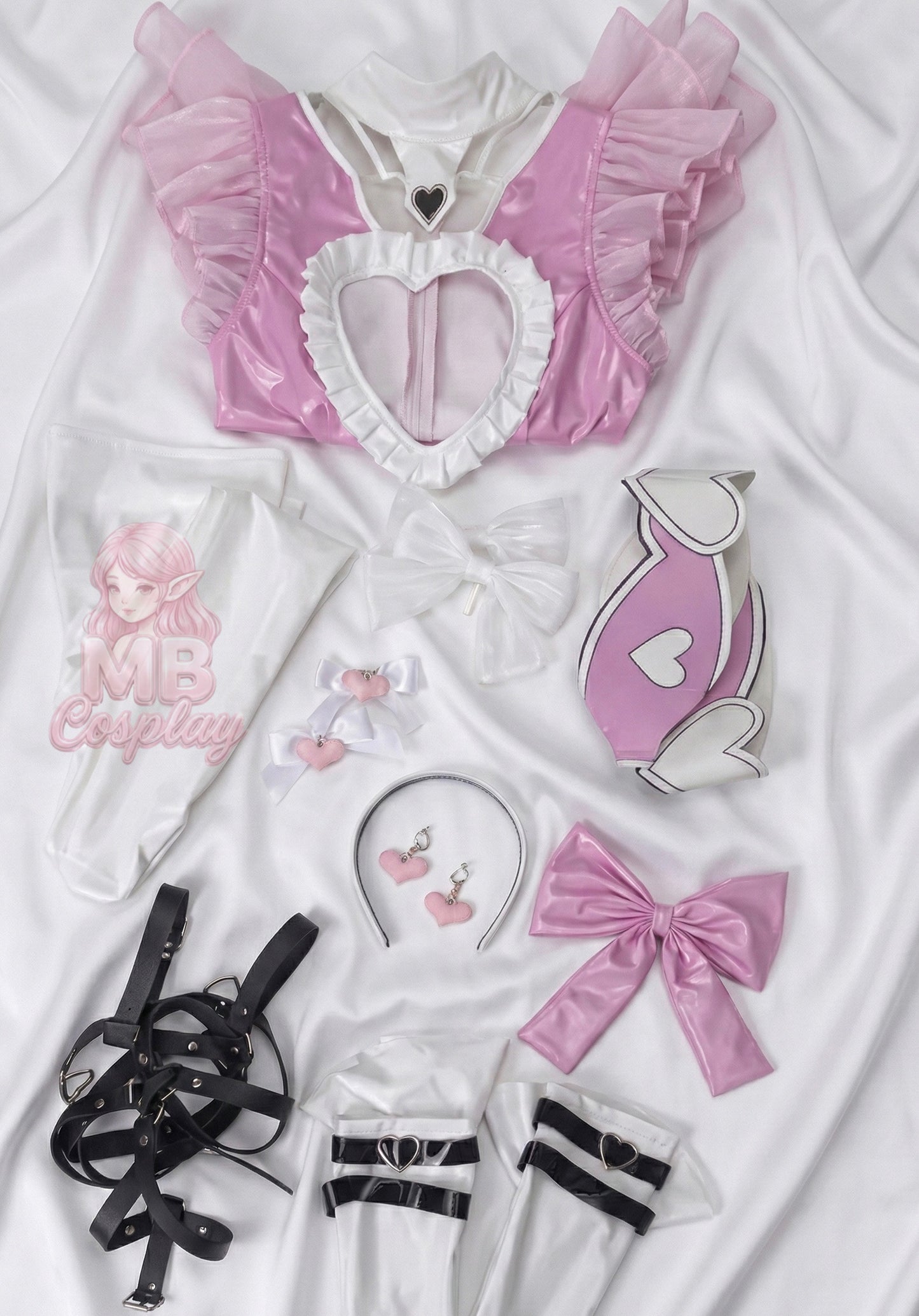 A flat lay display of the full Doll 2B costume set on white satin. Includes the pink bodysuit, white arm sleeves with black bands, a black leather body harness, pink bows, heart-shaped earrings, and a white headband.