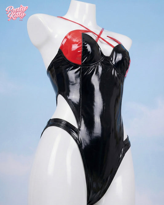 Side angle of the Inferno high-gloss bodysuit showing the high-leg cut and glossy finish.