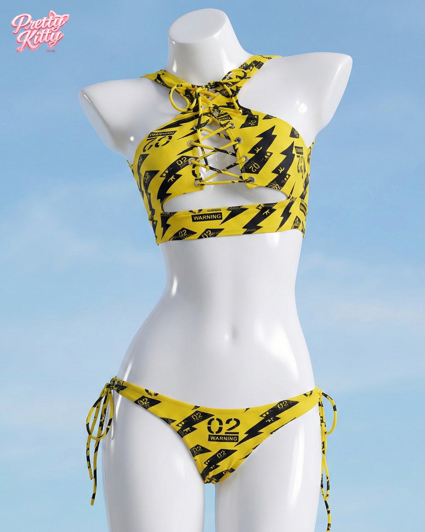 Front view of the yellow and black Zero Two Hazard set featuring a lace-up top and warning graphics.