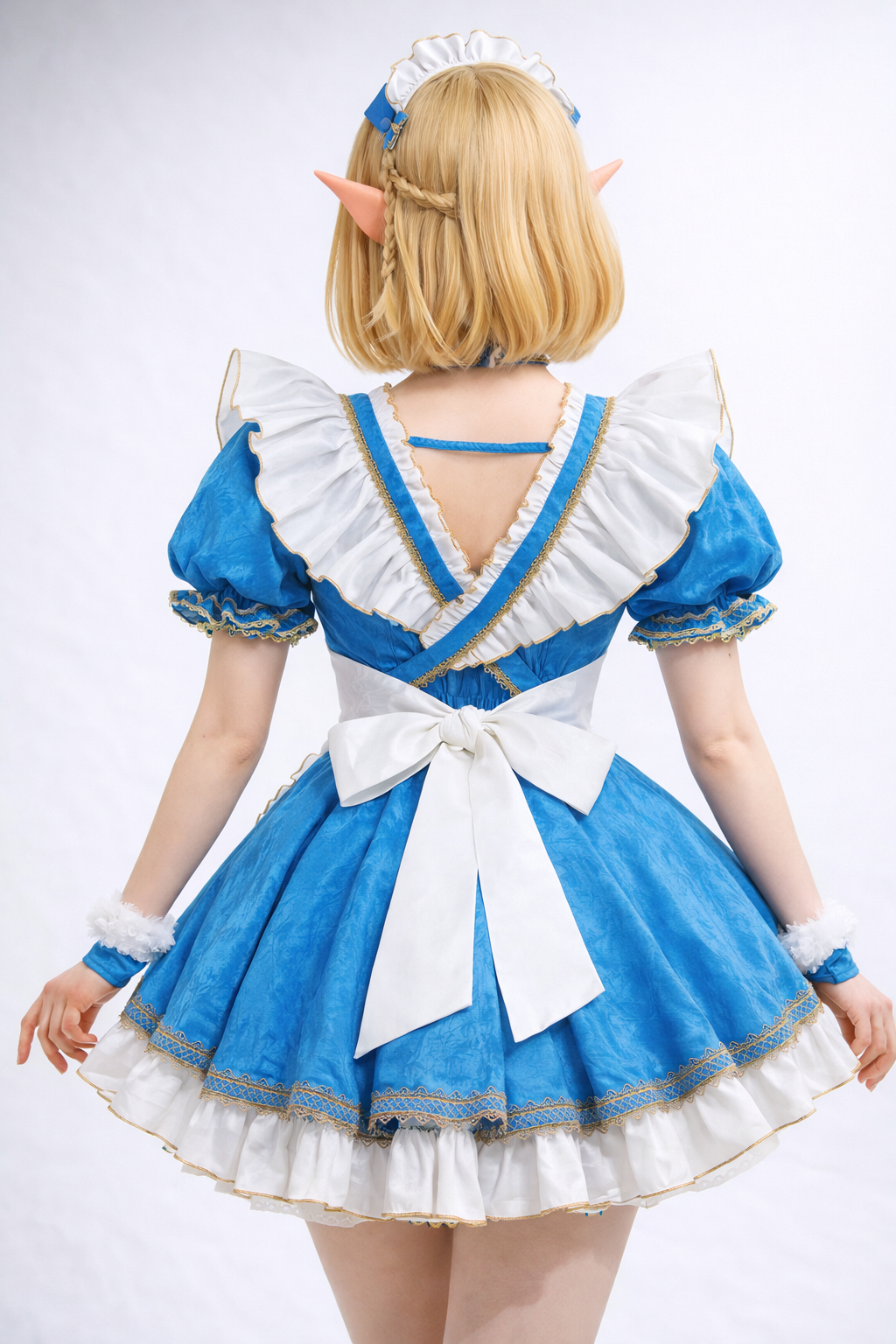 Back view of Zelda-inspired winter cosplay showing bow and layered skirt